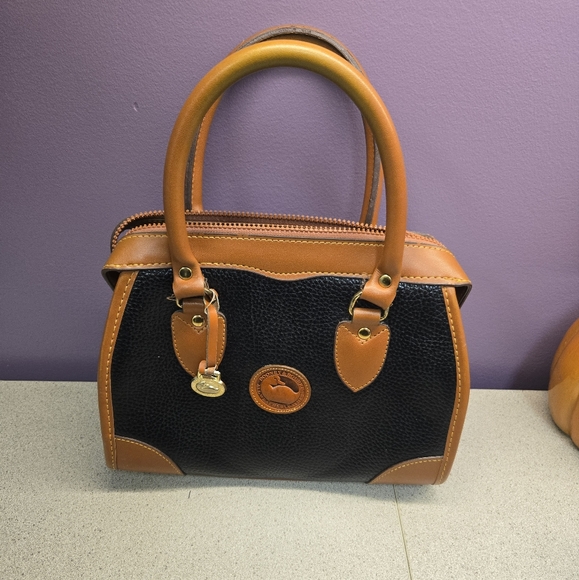 Dooney & Bourke Black and Tan Leather Satchel - Picture 1 of 9
